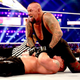 The Undertaker covers Brock Lesnar after a tombstone piledriver at WrestleMania XXX in New Orleans.